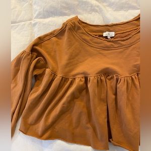 Boutique burnt orange peplum sweatshirt